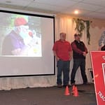 Homage paid to long-time tractor pull announcer