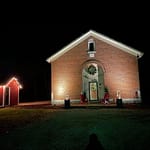 Armold, proud owner of Sugar Valley School