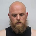 Former softball coach now in federal custody