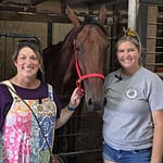 Women competing in harness racing at The Great Darke County Fair