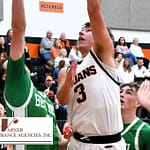 Trojans Blitz Bethel 68–38 in Season Opener