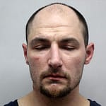 Warrant arrest made, drugs discovered