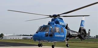 Driver rolls vehicle, airlifted to hospital