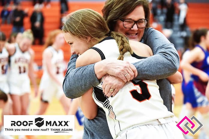 Ansonia sophomore Lydia Hahn gets a big hug from Assistant Kim Custenborder following Hahns winning basket. (Gaylen Blosser photo)